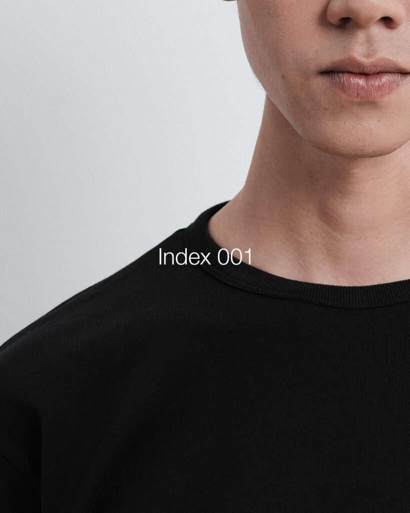 Close-up of the neckline of a black Finewale T-shirt