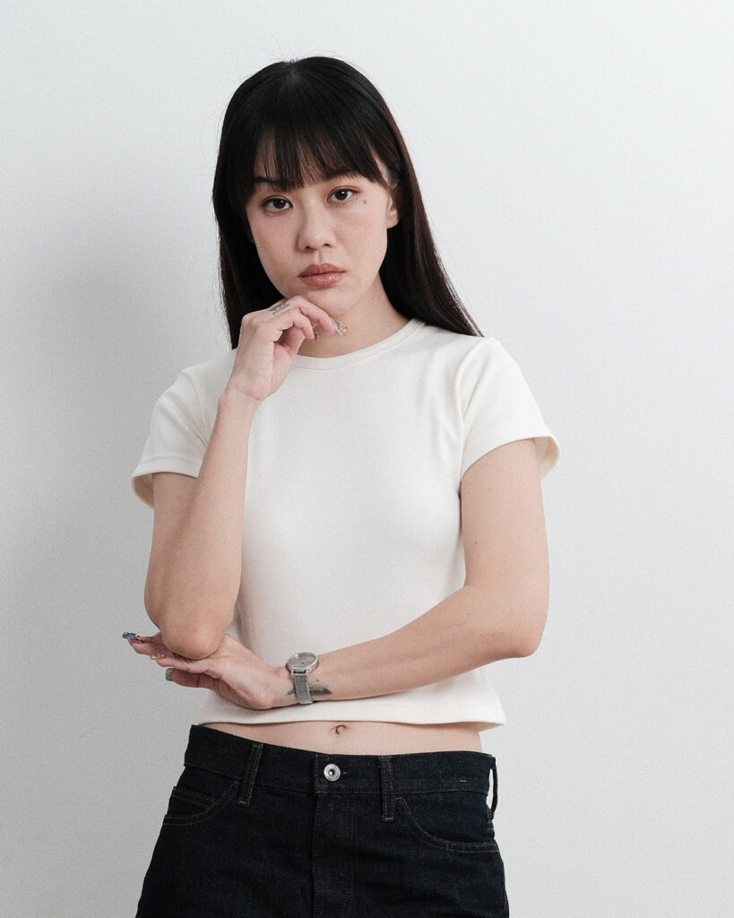 Woman wearing the Mini T-shirt in Cloud Dancer